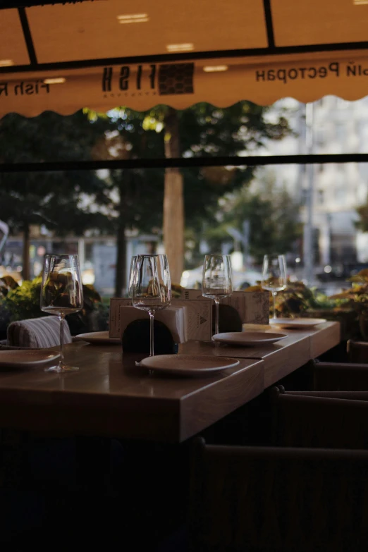 a group of empty glasses on top of a table