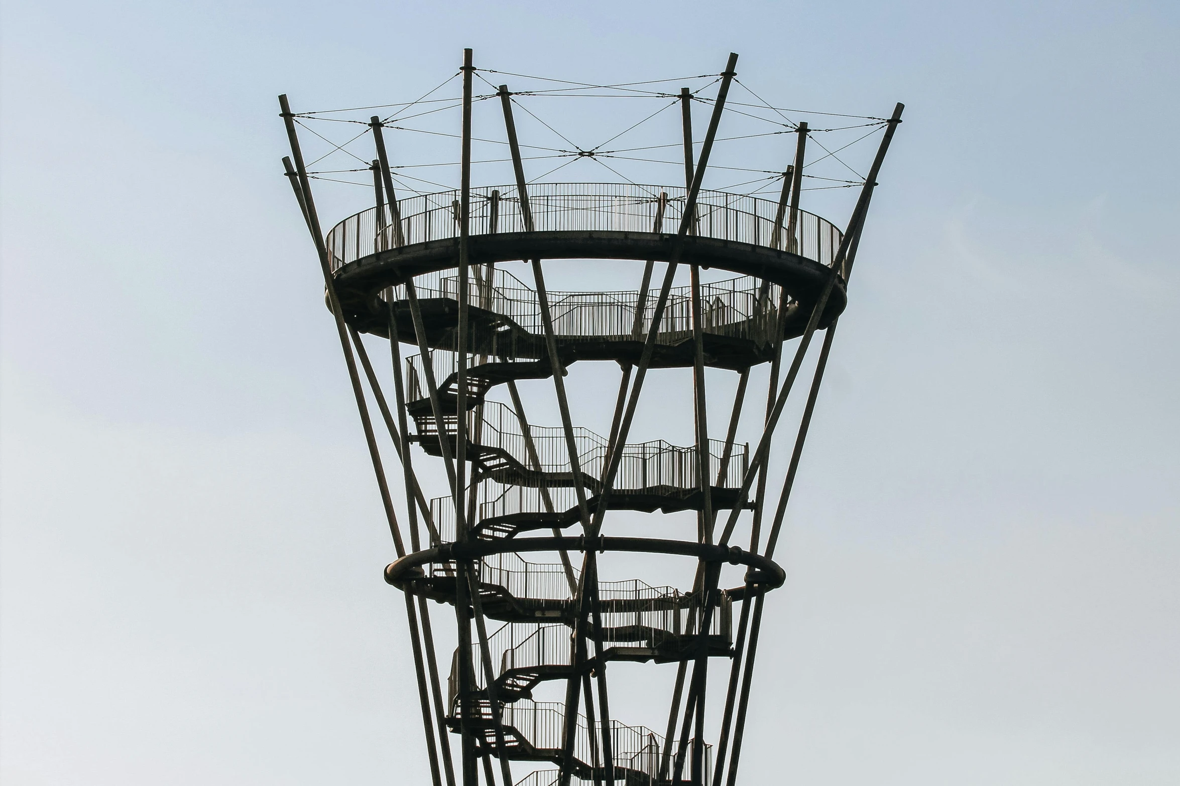 a large metal structure that has stairs on top of it