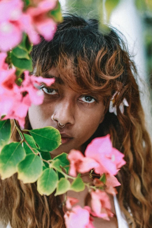 a close up of a child near flowers