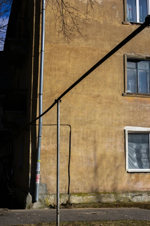 a long street light hanging from a pole