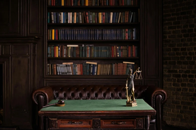 an old leather couch with a green table top