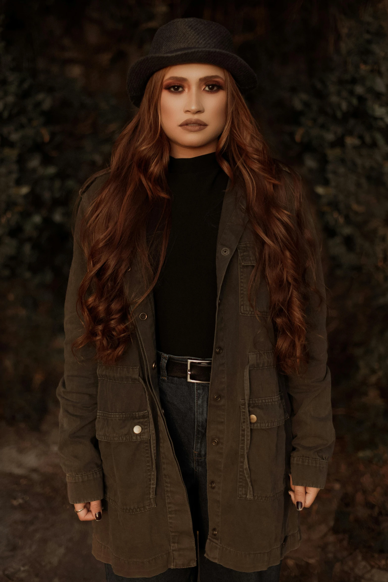 a girl in a black hat and coat