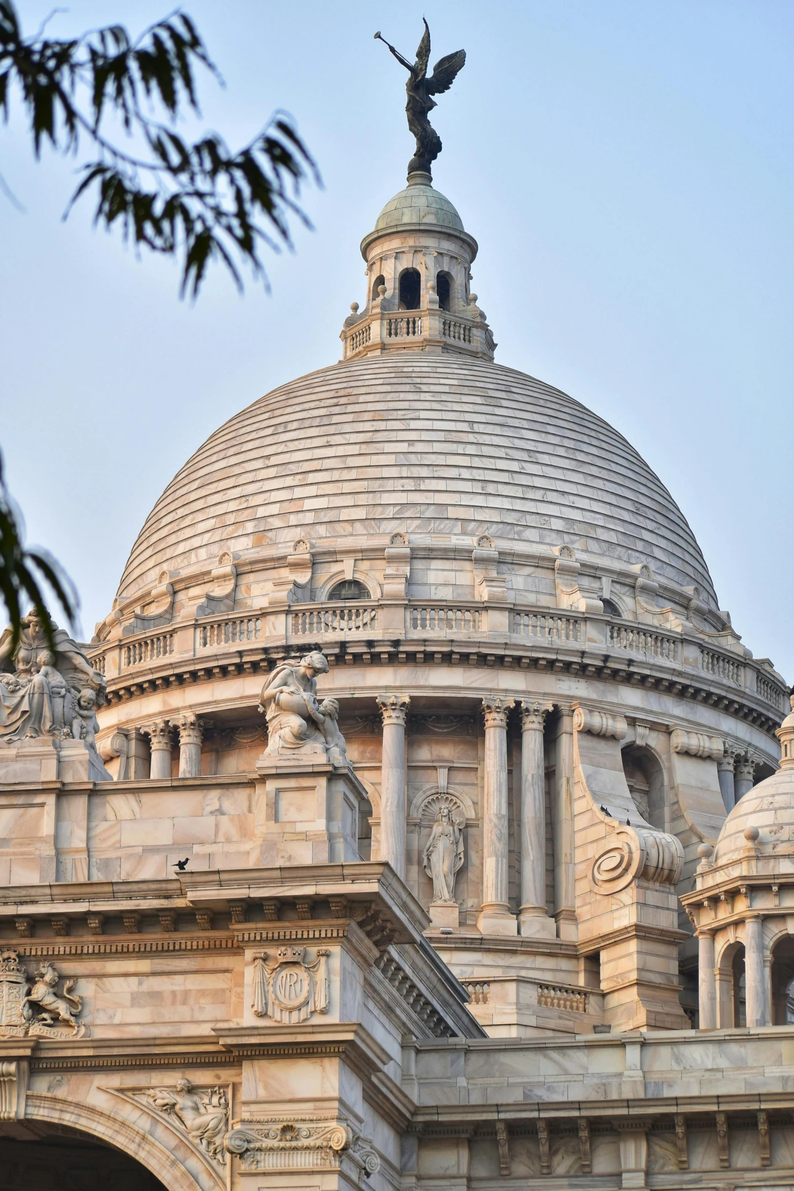 dome with statue atop on top of stone building