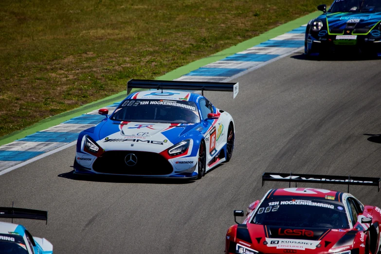 two race cars racing on a race track