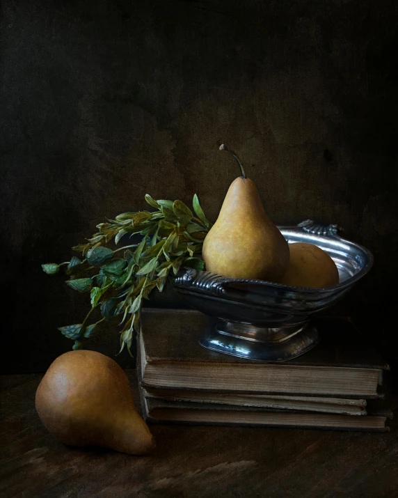 a painting shows a plate with three pears, next to a metal bowl and a stack of books