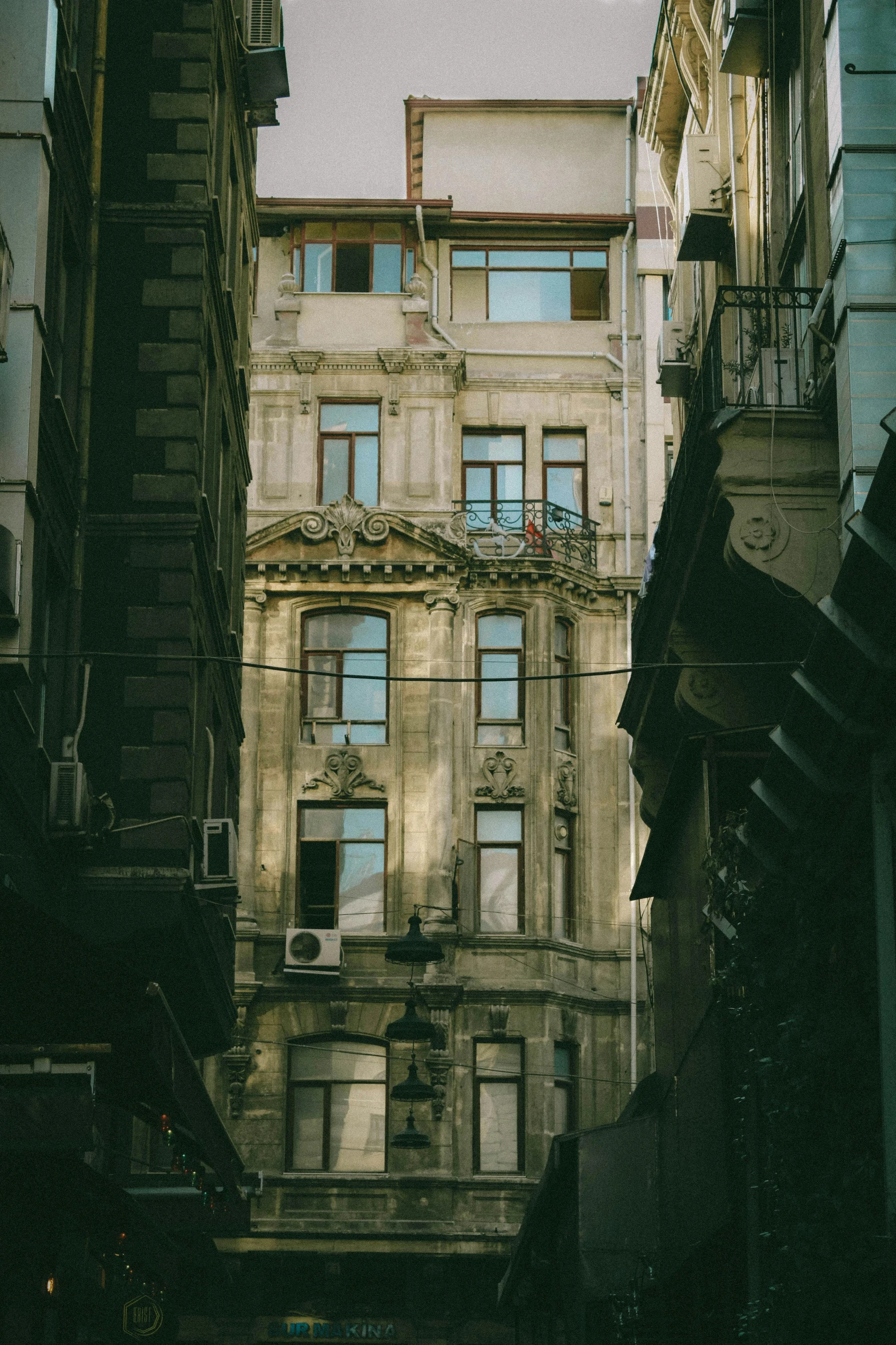 old buildings and balconies as seen from below