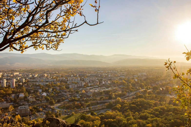 a view from the top of a hill looking down at a city