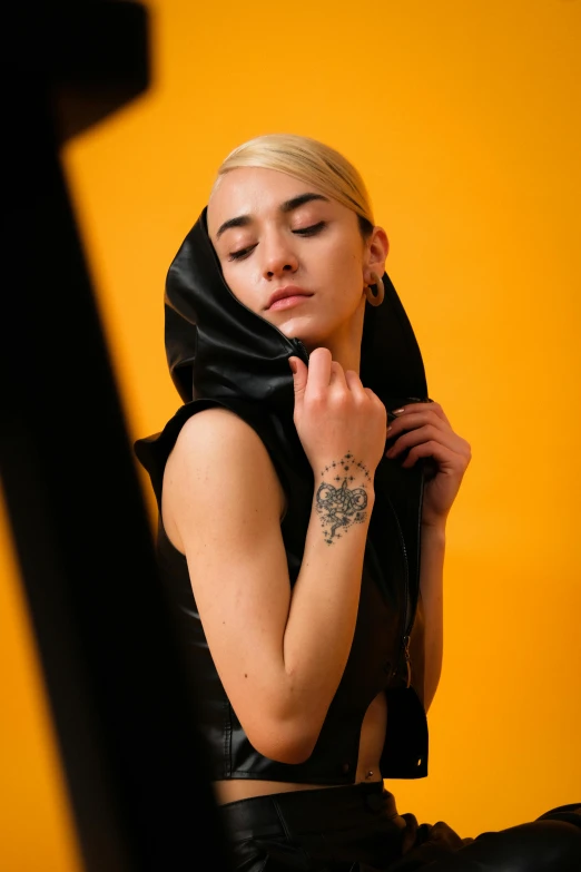 a girl wearing a black shirt and scarf