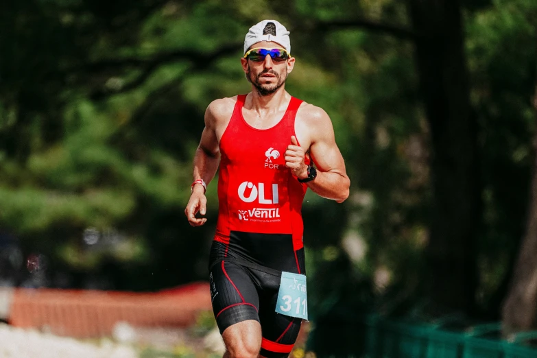 a man wearing red running on the road