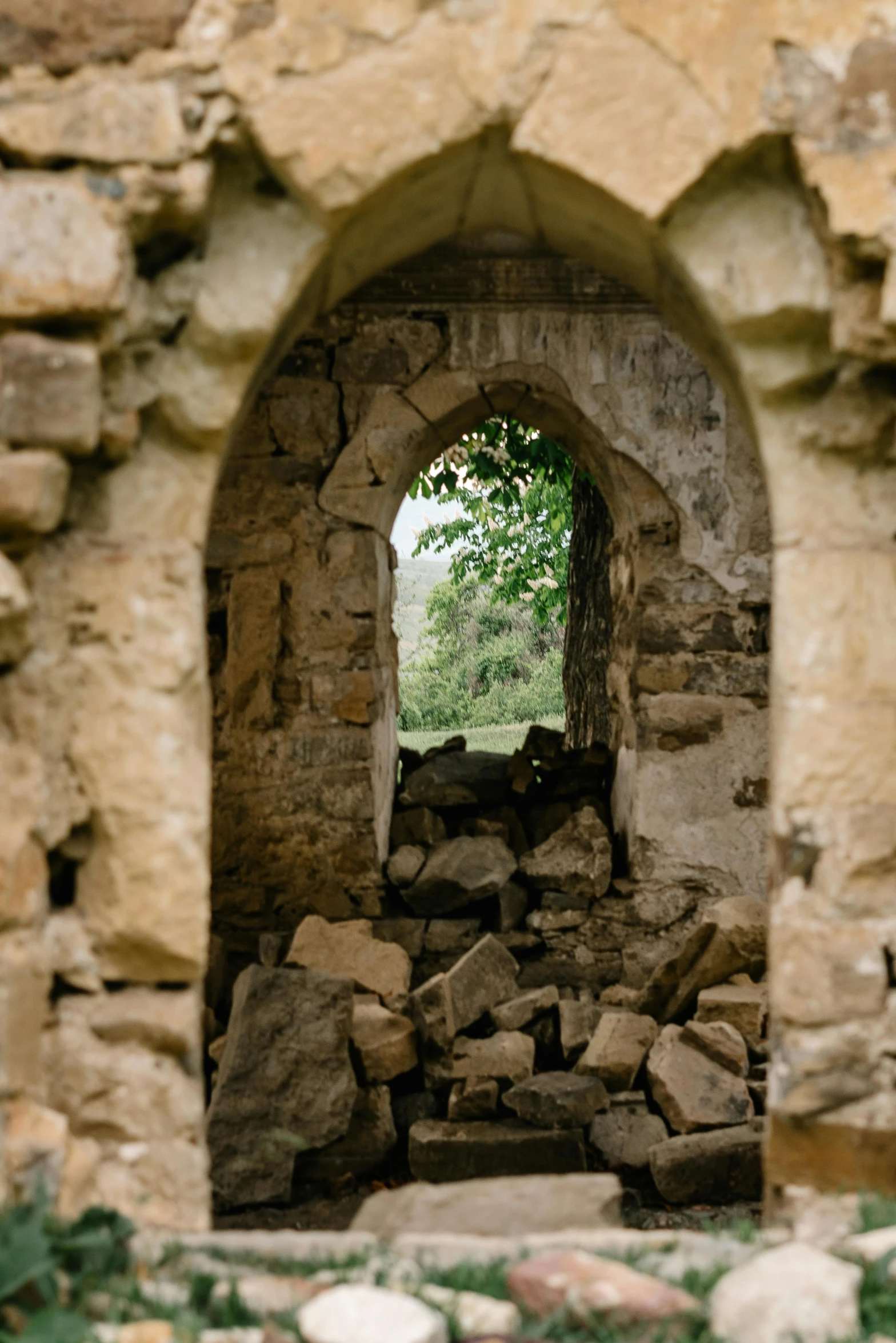 a stone window with an open sky in the background