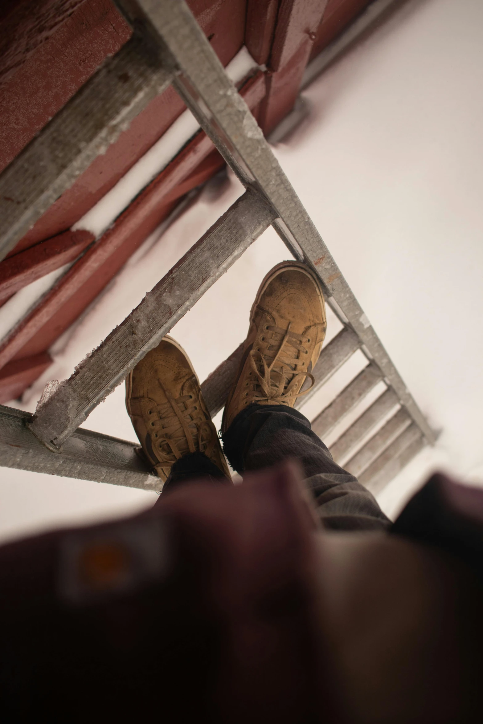 a person with their feet up on a step ladder