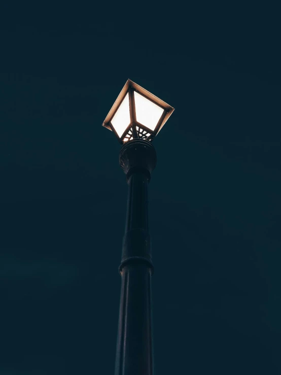 a close up view of a street lamp at night