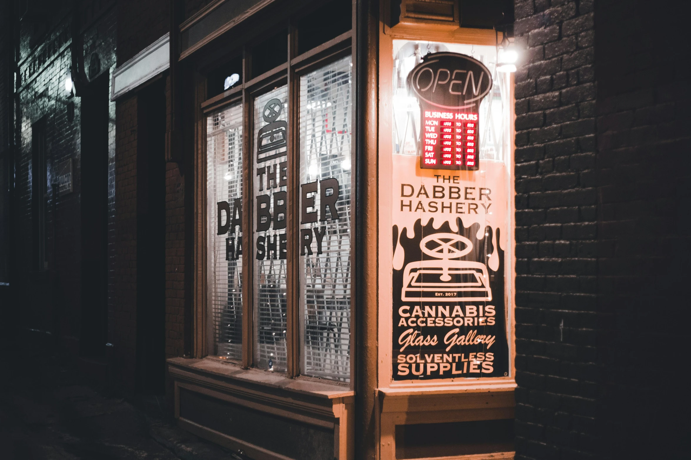 an old fashioned sign outside the window of a building