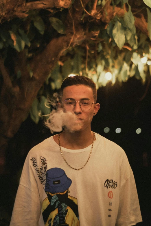 a man in white shirt smoking on a cigarette