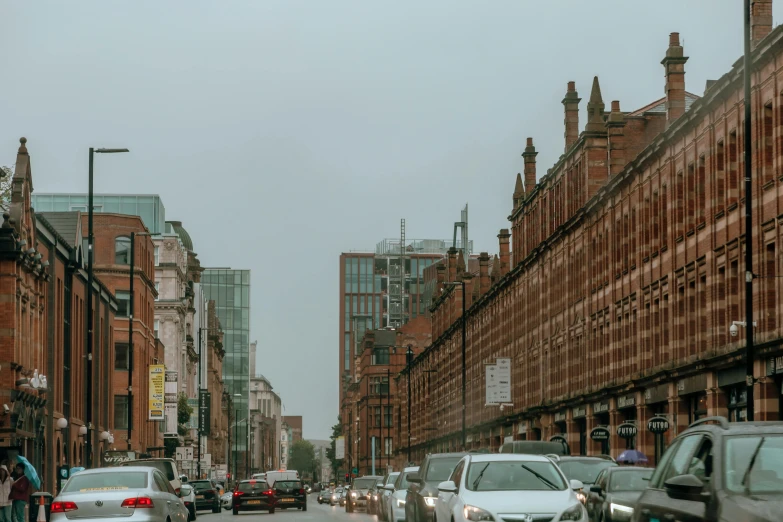 busy city street with cars and pedestrians in the rain