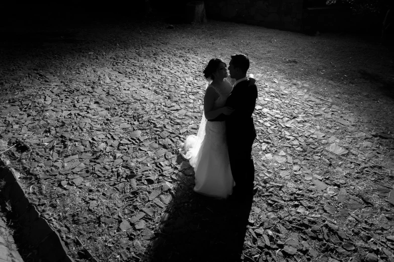 bride and groom emcing together on the side walk