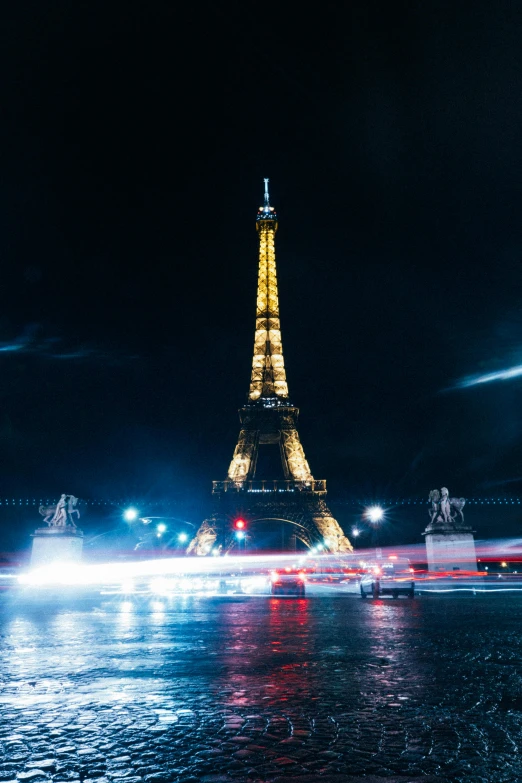 a po taken at night looking towards the eiffel tower