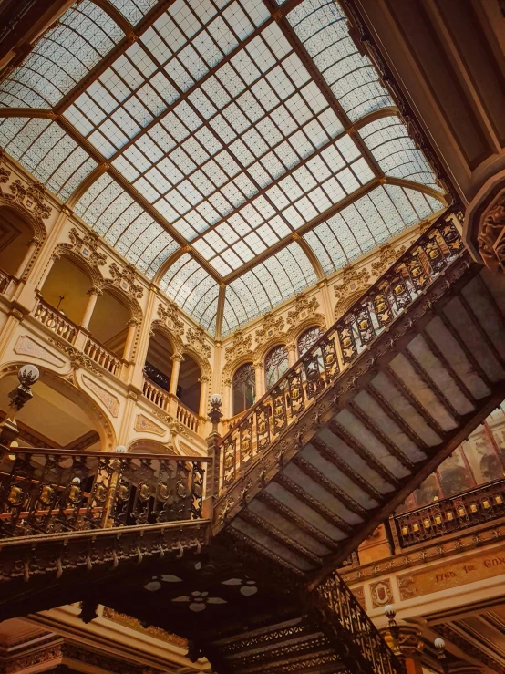 an interior of a large building with lots of glass