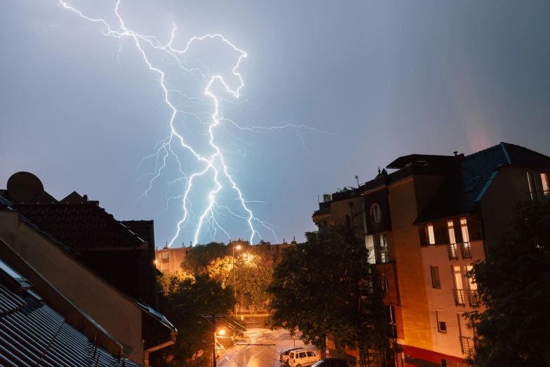 a very large lightning storm is striking through the sky