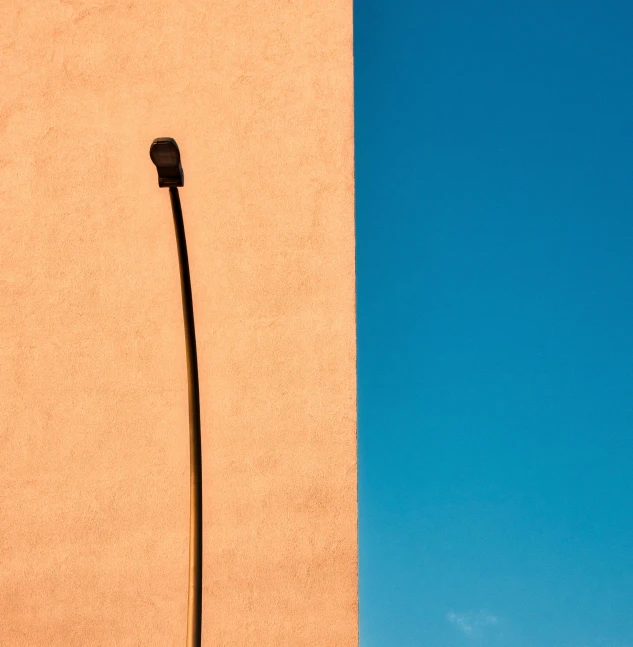 a street light on the side of a wall