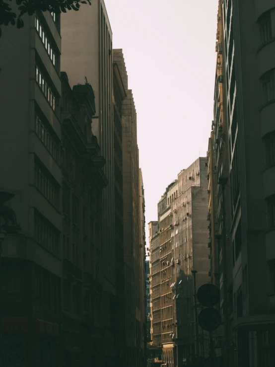 a city with skyscrs and cars on a sunny day