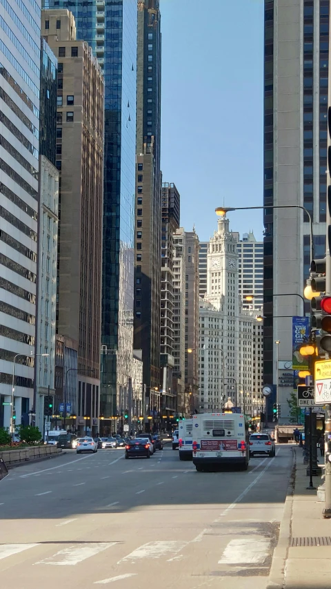 a street in the middle of a city with tall buildings