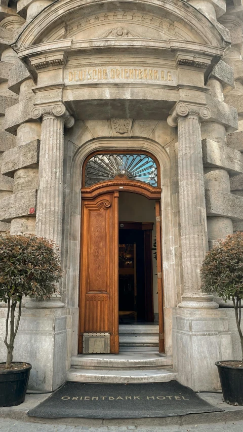 an old building with doors and steps to the entrance