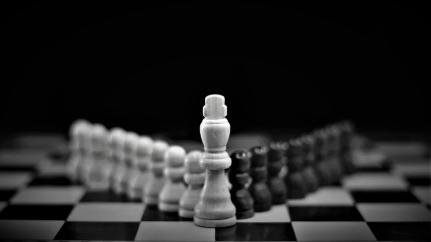 a chess board with all of the pieces black and white
