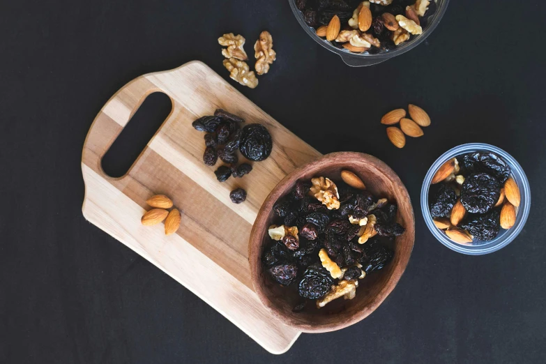 an image of bowls filled with food and nuts