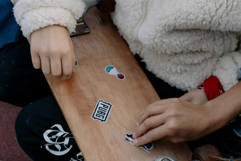 woman  up a skateboard with several pieces cut out