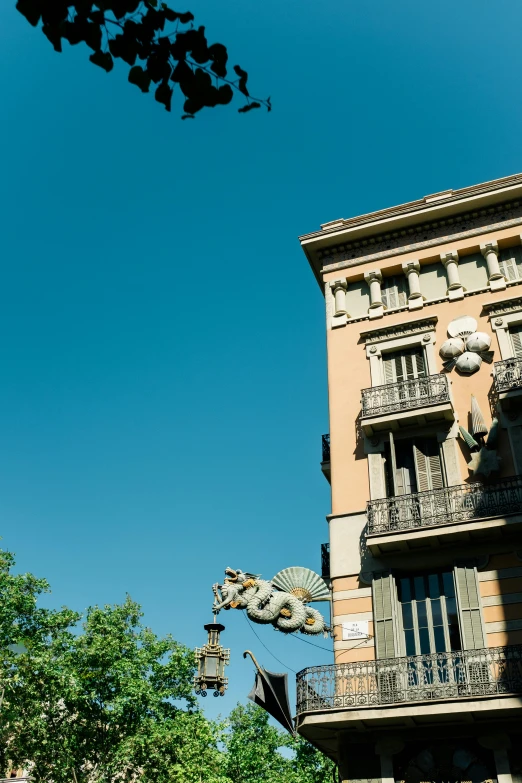 looking up at the balconies and balcony of a house