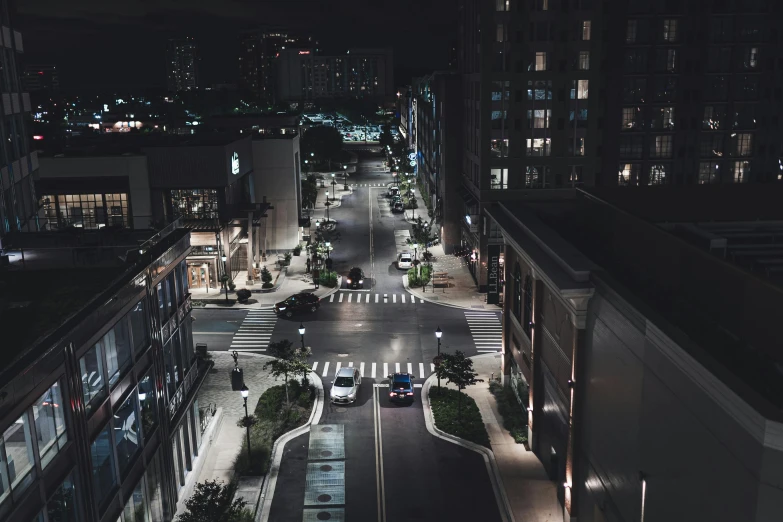 an empty street with a traffic light at night