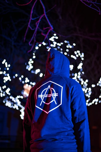 a hooded hoodie with an anarchy sticker on it