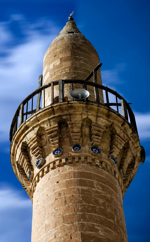 a tower that is sitting near some clouds