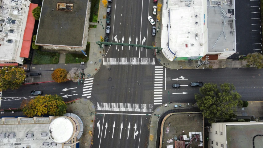 an aerial view of an intersection with buildings