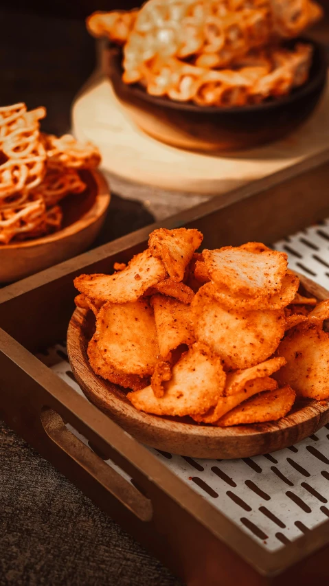 a plate full of fried fritters with other plates in the background