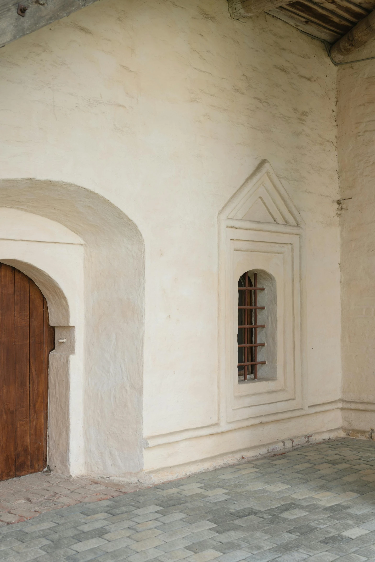 a building with a wood door and brown doors