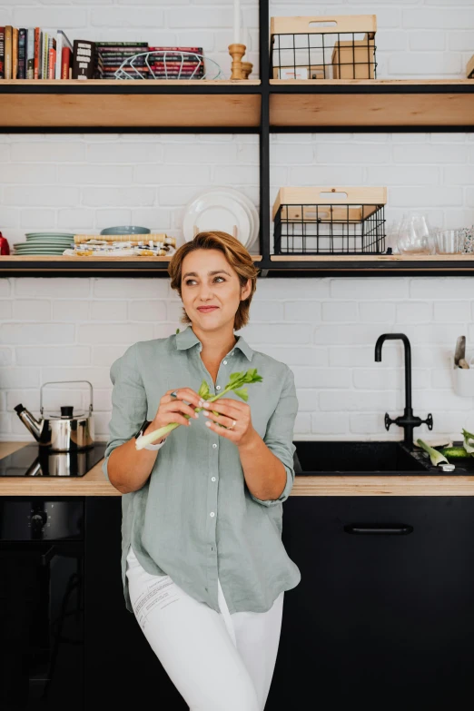 a woman sits in front of some food