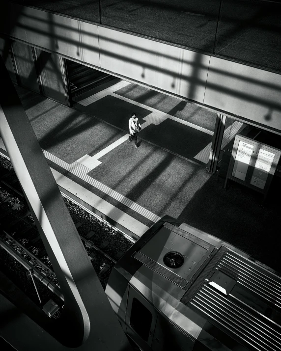 black and white pograph of aerial view of room from high up