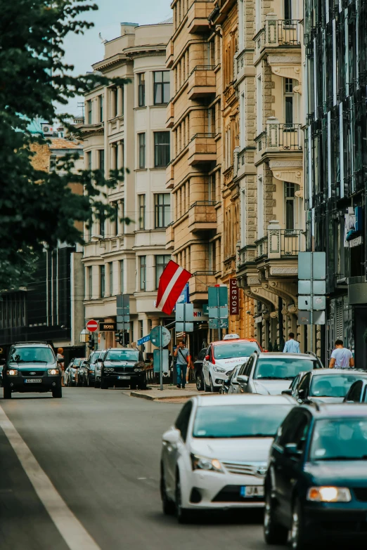 a street with several cars parked on both sides of it