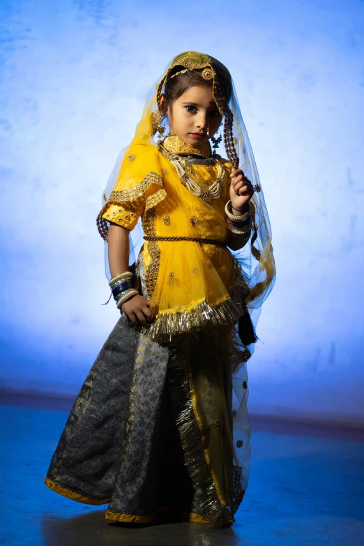 a little girl dressed in a traditional costume