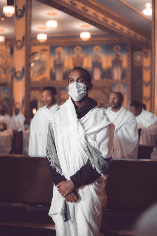 a priest wearing a mask in a church