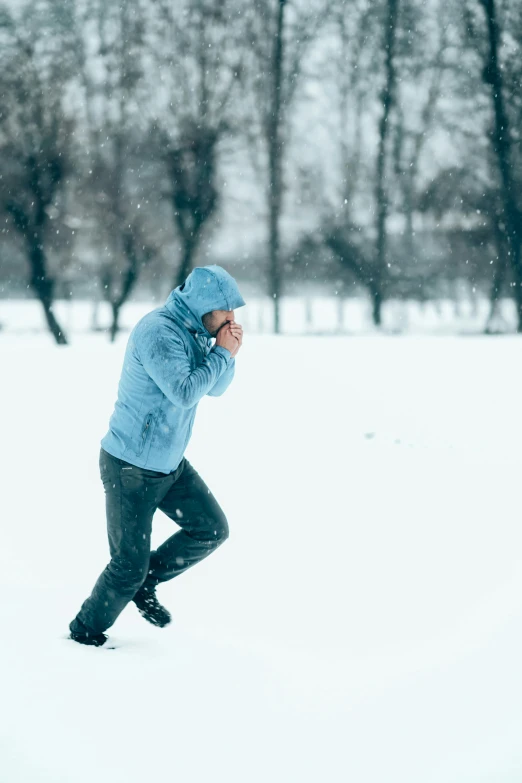 a person wearing snow gear in the snow