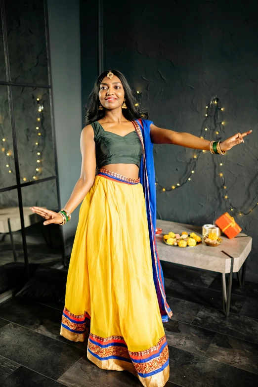 a woman standing in a room with a yellow skirt
