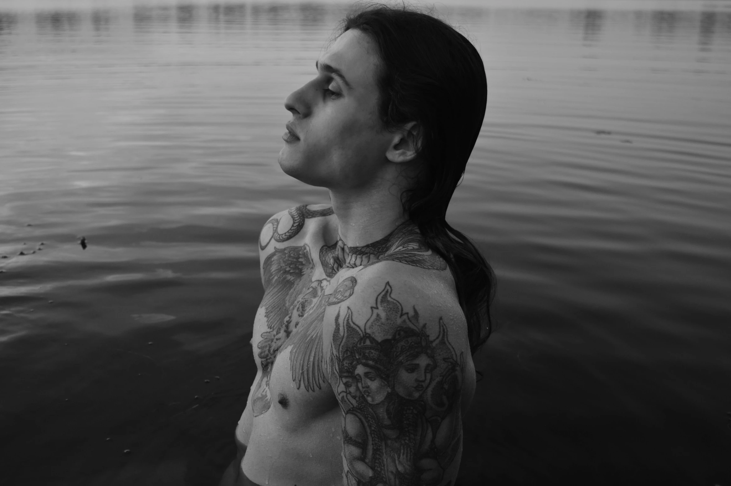 an image of a tattooed girl in water