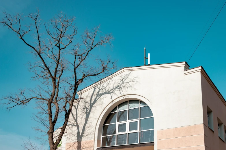 a window and sky line above a church