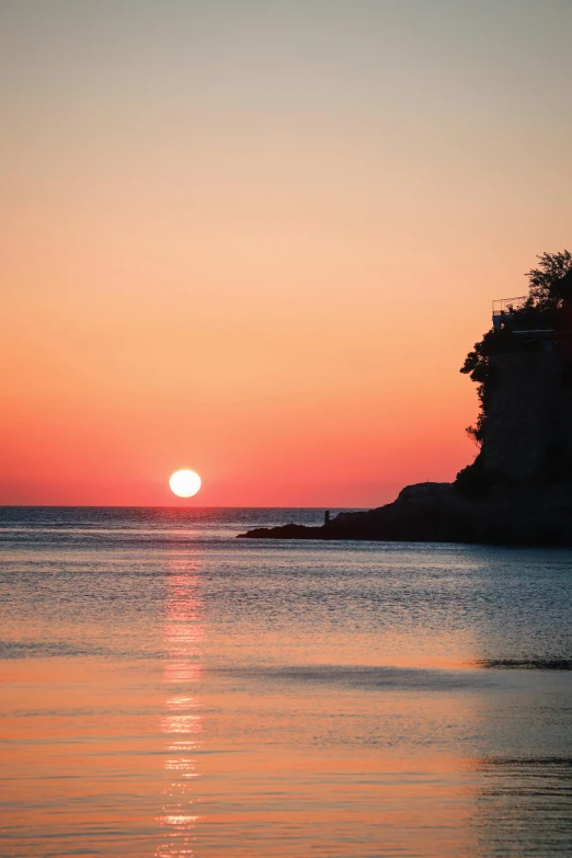 an image of the sunset over a body of water