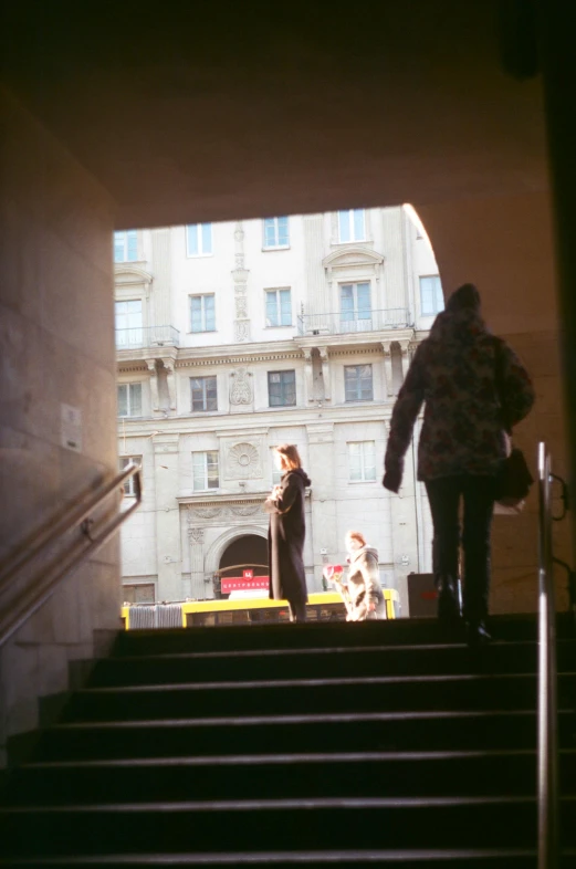 some people on some steps in the city