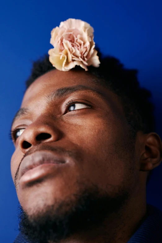 a man with a flower on his head