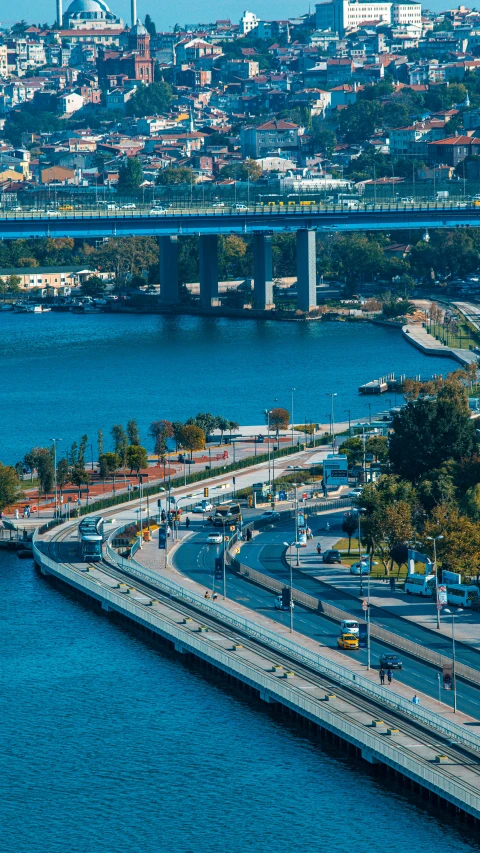 a view of a large body of water with a bridge and buildings